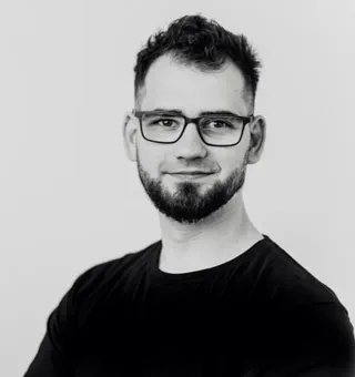 Professional portrait of Maciej Szymczak.